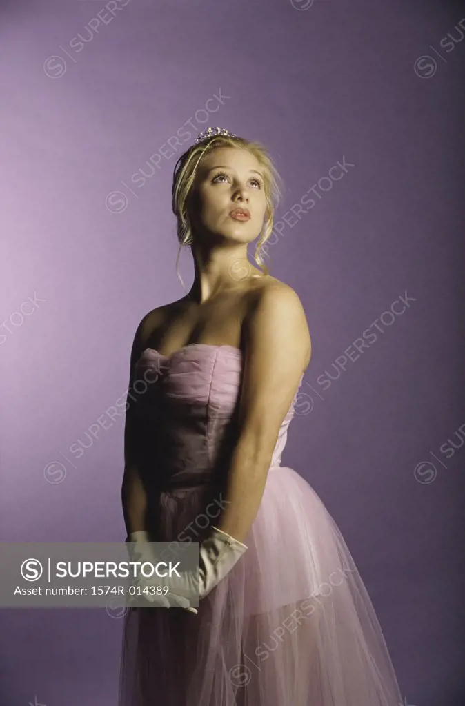 Side profile of a teenage girl looking up