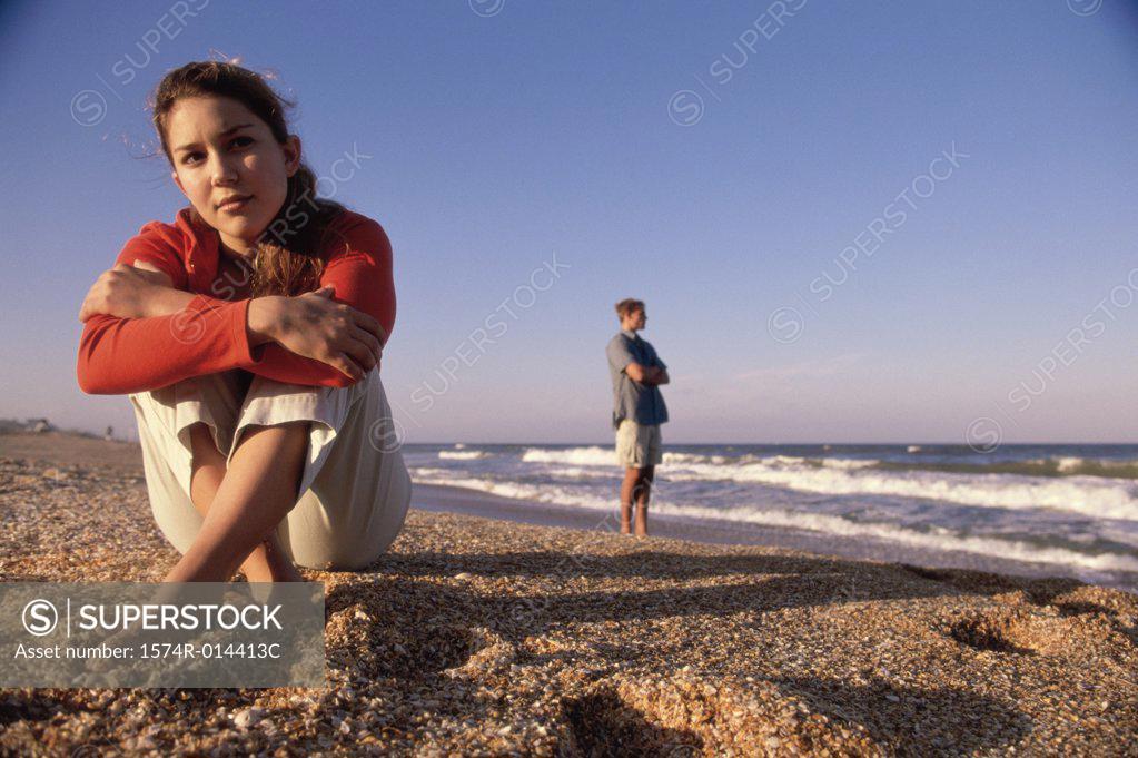 Stock Photo: 1574R-014413C Close-up of a teenage girl sitting on the beach