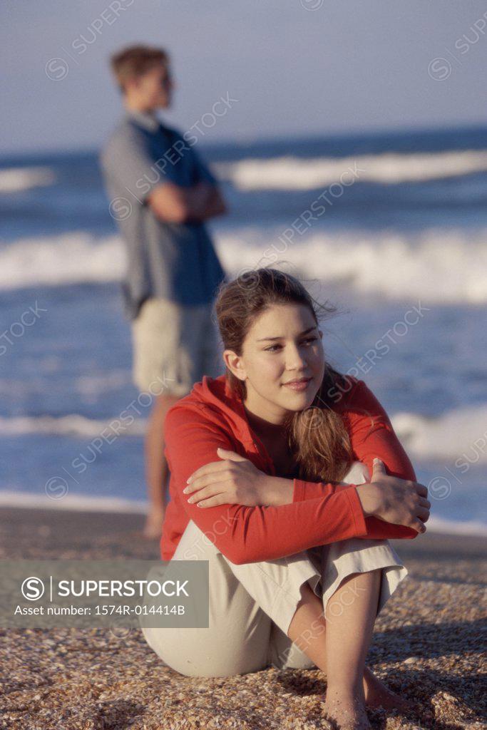 Stock Photo: 1574R-014414B Close-up of a teenage girl sitting on the beach