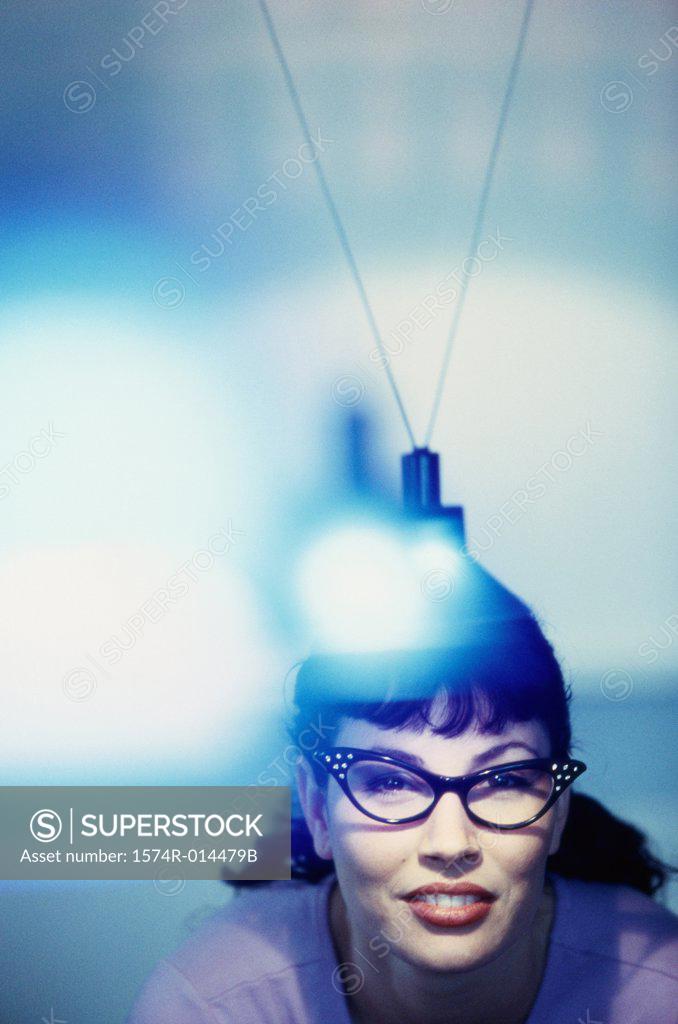 Stock Photo: 1574R-014479B Portrait of a young woman wearing eyeglasses