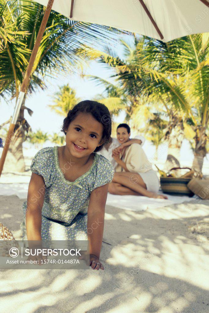 Stock Photo: 1574R-014487A Portrait of a girl smiling on the beach