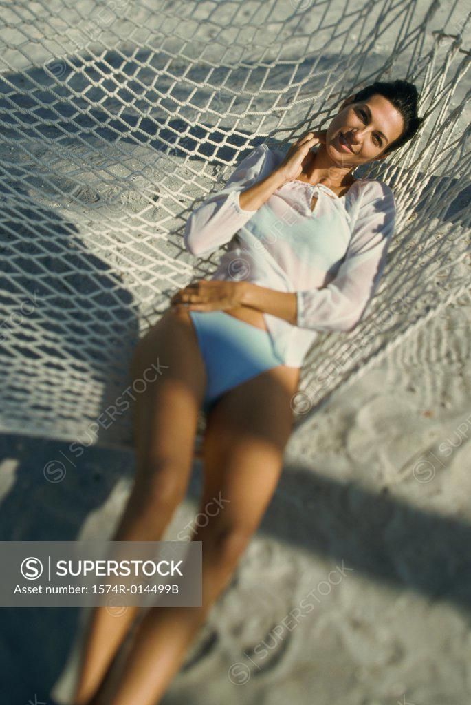Stock Photo: 1574R-014499B High angle view of a young woman lying in hammock
