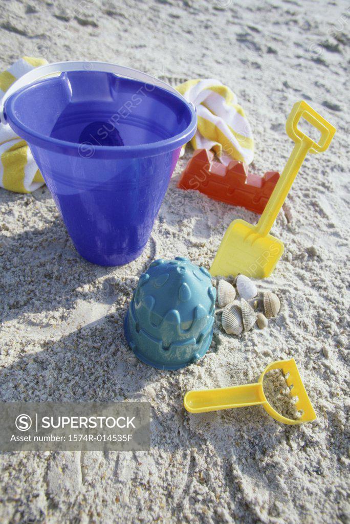 Stock Photo: 1574R-014535F High angle view of a sand pail and a shovel on the beach