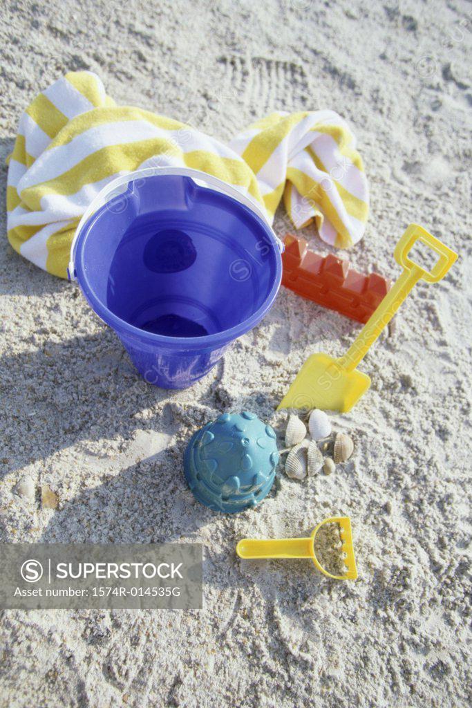 Stock Photo: 1574R-014535G High angle view of a sand pail and a shovel on the beach