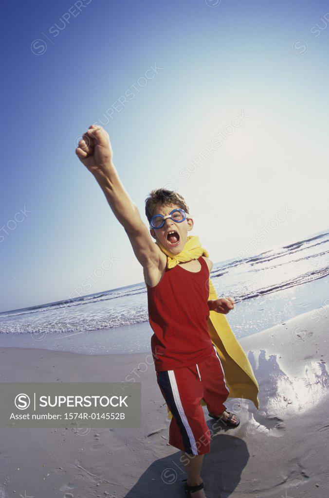 Stock Photo: 1574R-014552B Portrait of a boy playing on the beach