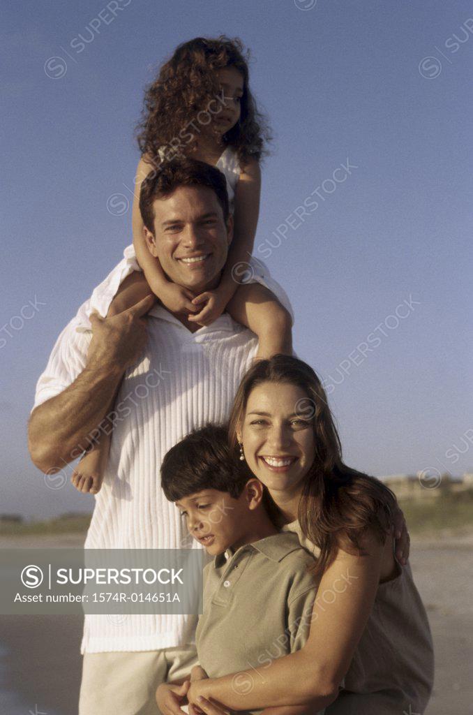 Stock Photo: 1574R-014651A Portrait of parents and their two children on the beach