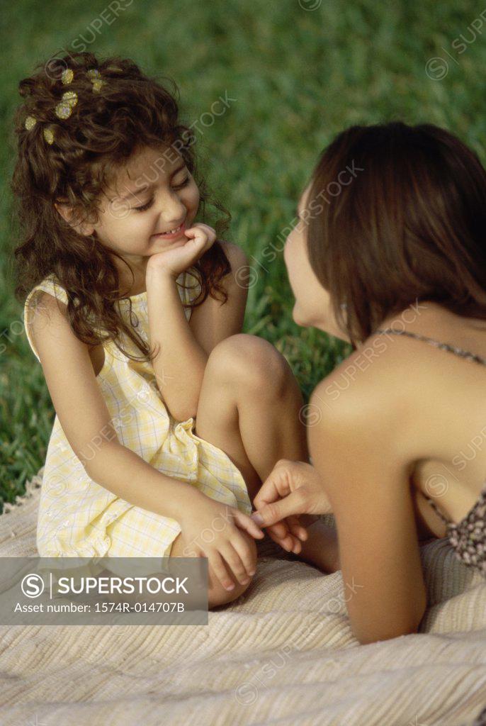 Stock Photo: 1574R-014707B Daughter sitting with her mother in a park