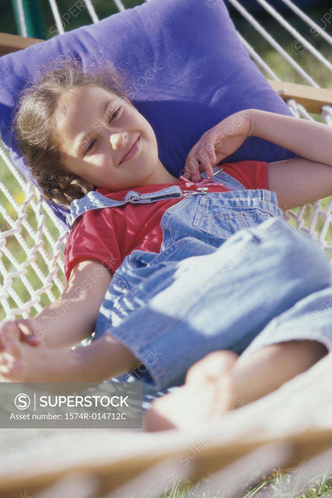 Stock Photo: 1574R-014712C Girl lying in a hammock