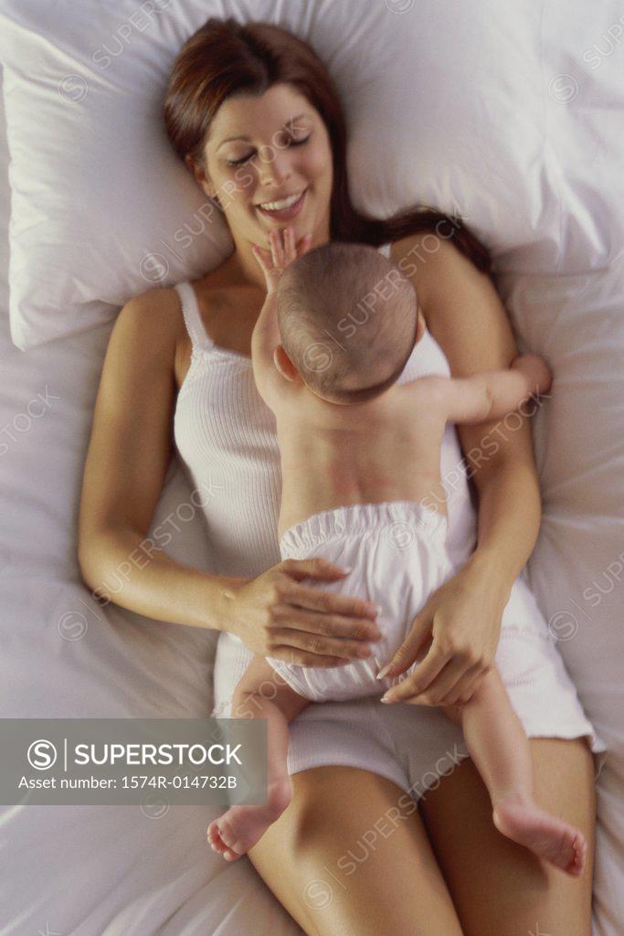 Stock Photo: 1574R-014732B High angle view of a mother lying with her baby boy