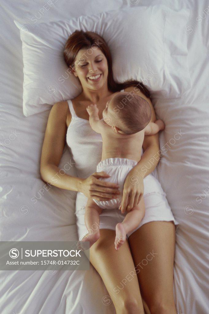 Stock Photo: 1574R-014732C High angle view of a mother lying with her baby boy