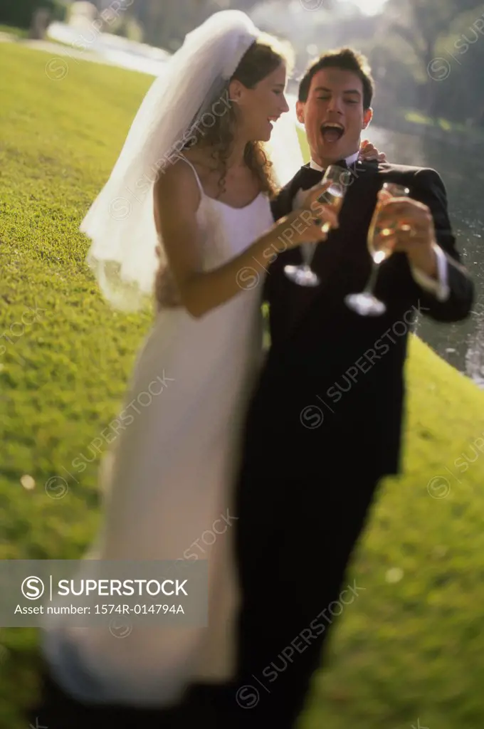 Newlywed couple toasting with champagne