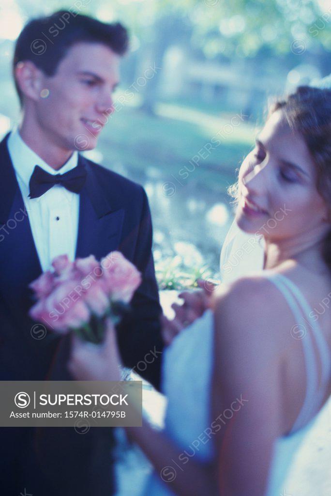 Stock Photo: 1574R-014795B Newlywed couple looking at each other