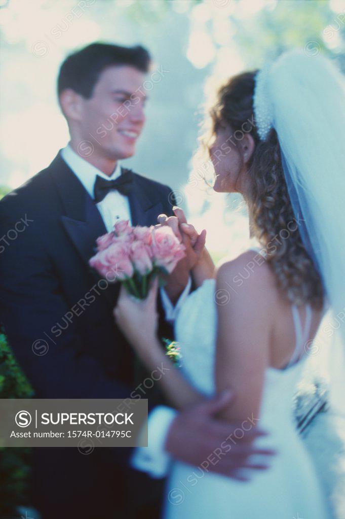 Stock Photo: 1574R-014795C Newlywed couple looking at each other