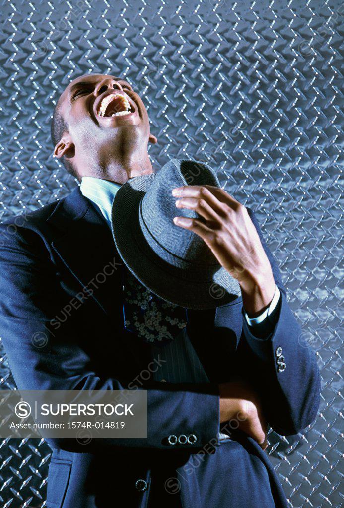 Stock Photo: 1574R-014819 Close-up of a businessman laughing