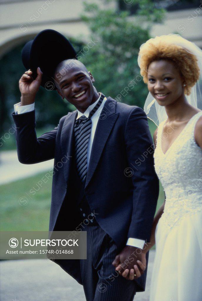 Stock Photo: 1574R-014868 Portrait of a newlywed couple smiling