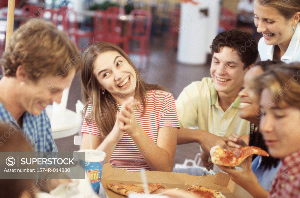 Stock Photo: 1574R-014880 Group of teenagers smiling in a restaurant