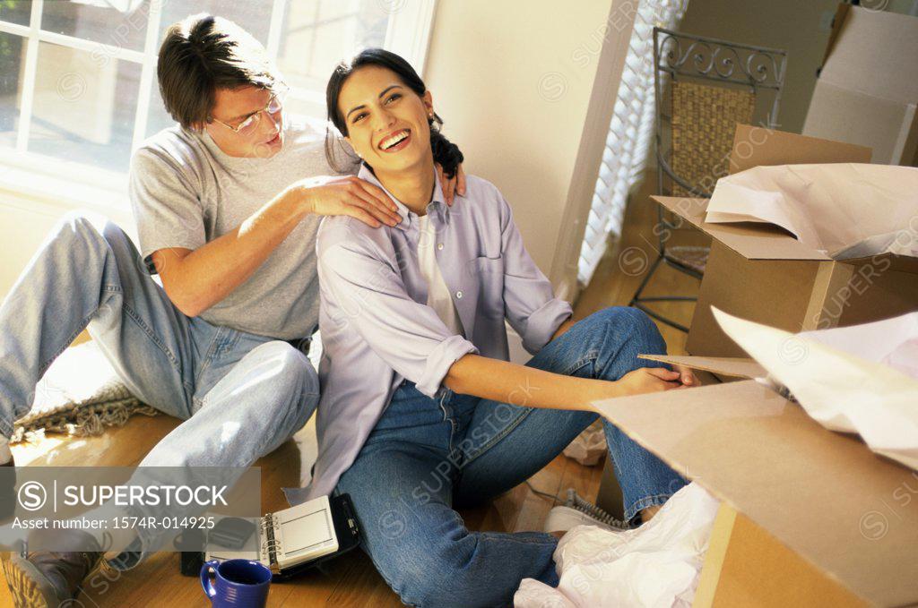 Stock Photo: 1574R-014925 High angle view of a young man massaging a young woman's shoulders