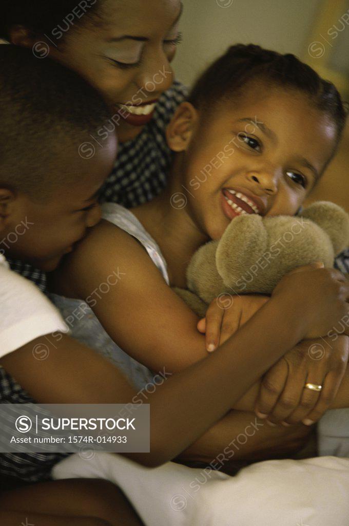 Stock Photo: 1574R-014933 Close-up of a mother smiling with her two children