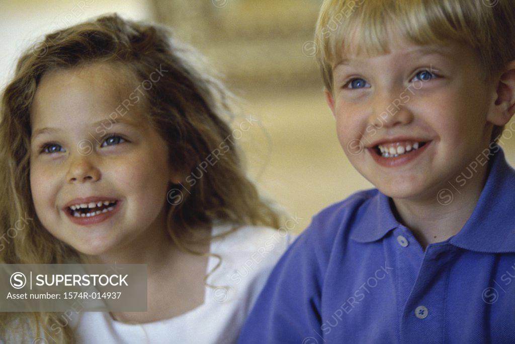 Stock Photo: 1574R-014937 Close-up of a boy and girl smiling