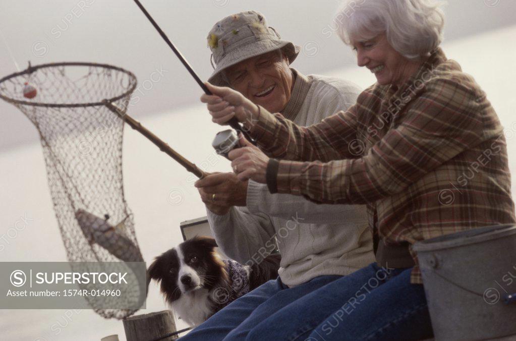 Stock Photo: 1574R-014960 Side profile of a senior couple fishing
