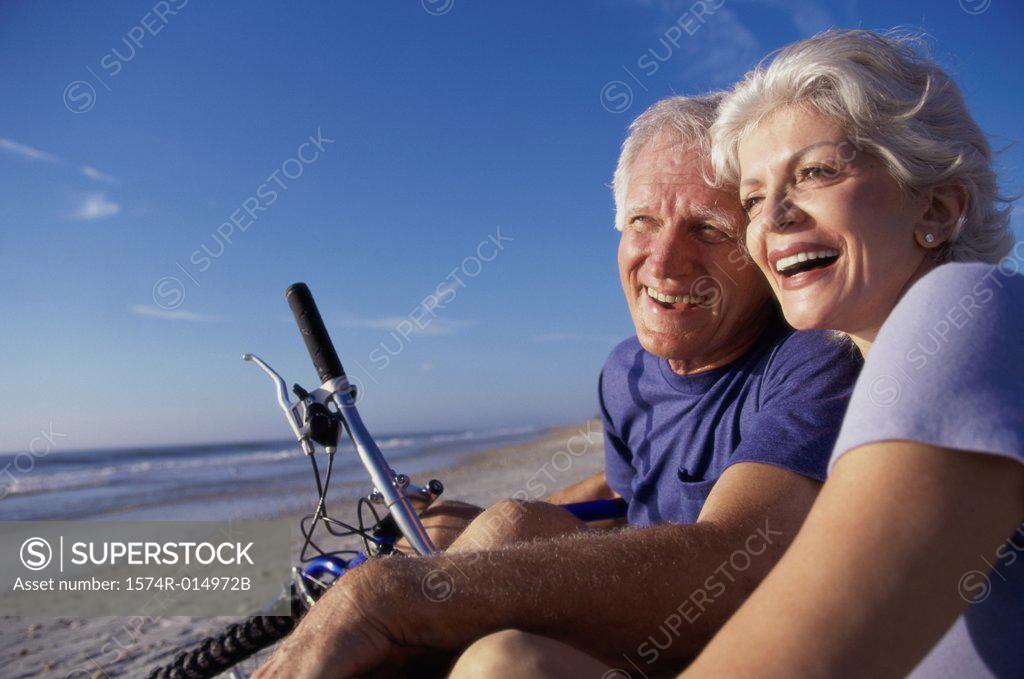 Stock Photo: 1574R-014972B Close-up of a senior couple sitting on the beach