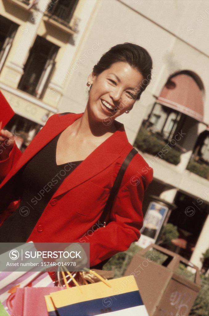 Stock Photo: 1574R-014978 Close-up of a young woman holding a shopping bag