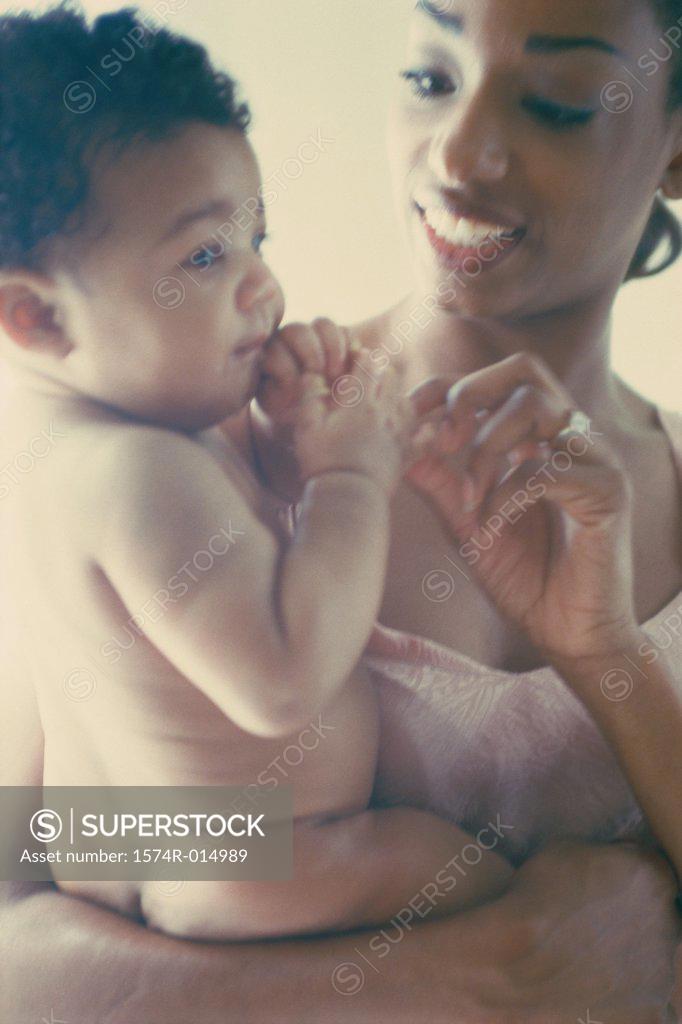 Stock Photo: 1574R-014989 Close-up of a mother playing with her son