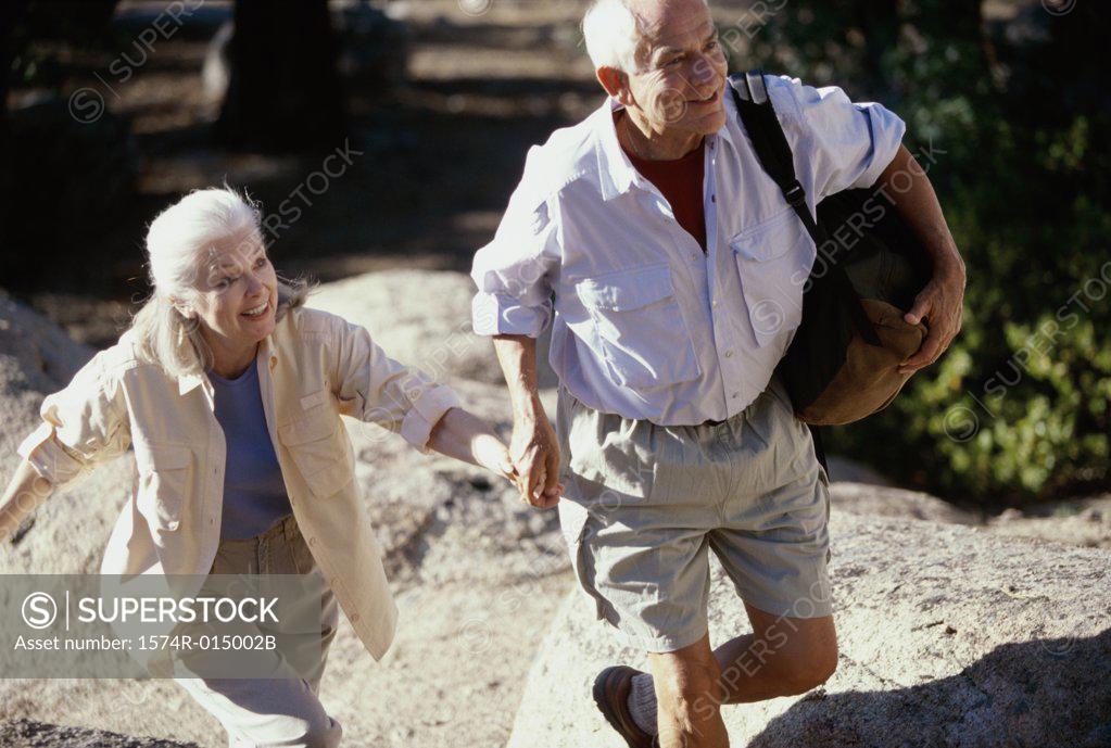 Stock Photo: 1574R-015002B Senior couple walking holding hands