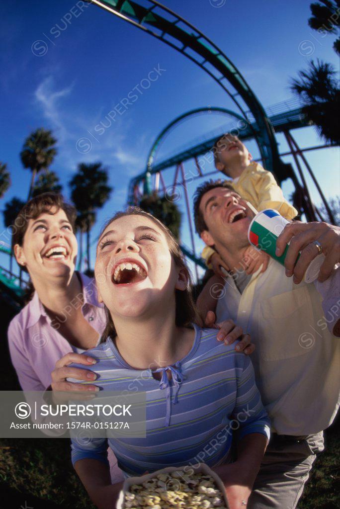 Stock Photo: 1574R-015127A Low angle view of parents with their son and daughter in an amusement park
