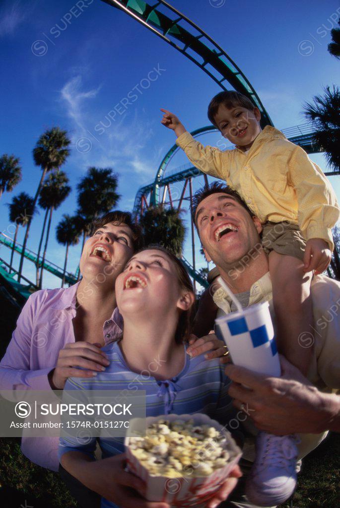 Stock Photo: 1574R-015127C Low angle view of parents with their son and daughter in an amusement park