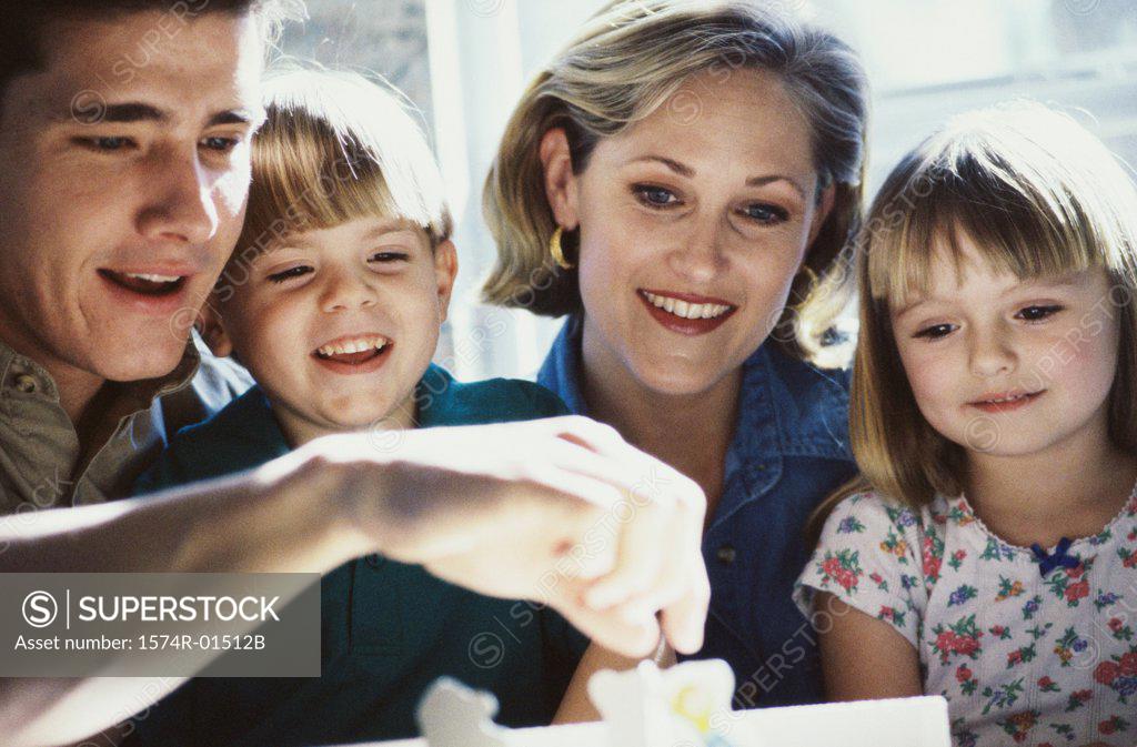 Stock Photo: 1574R-01512B Parents and their two children smiling