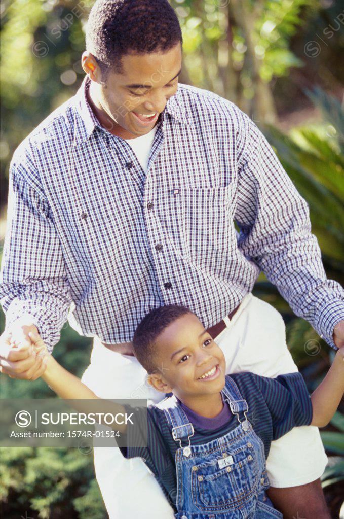 Stock Photo: 1574R-01524 Father and son standing together