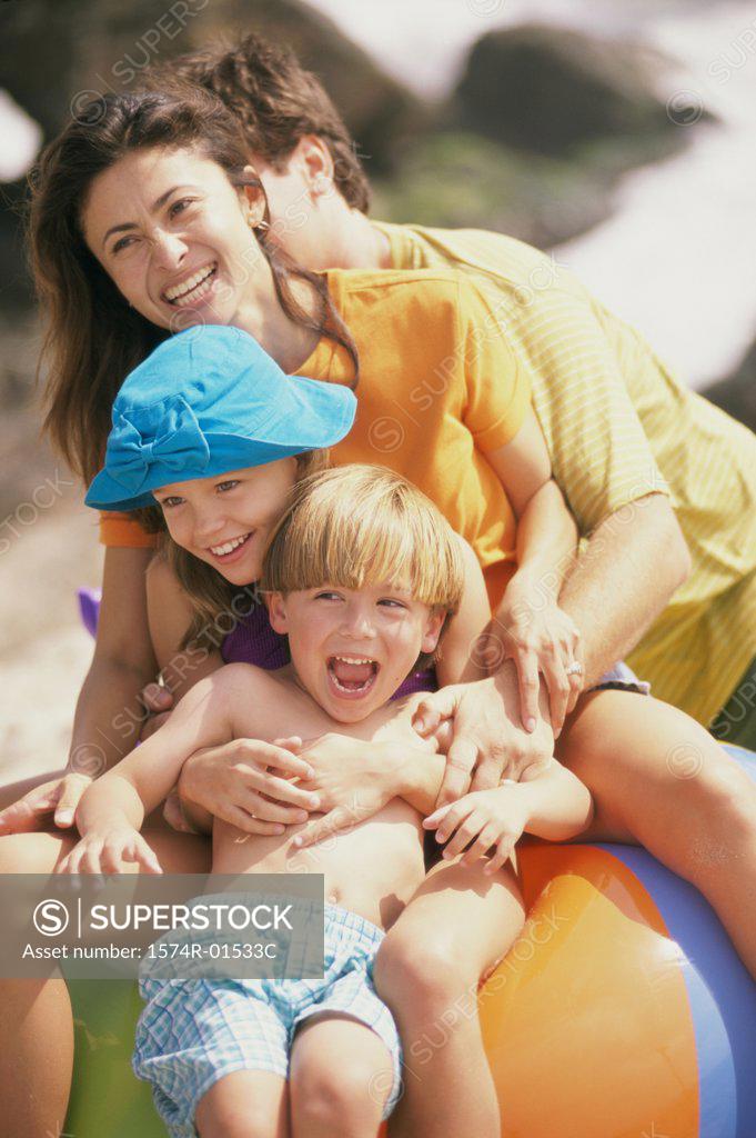 Stock Photo: 1574R-01533C Father and mother with their children