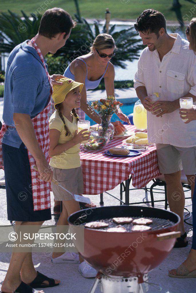 Stock Photo: 1574R-015414A Family enjoying picnic with their friends