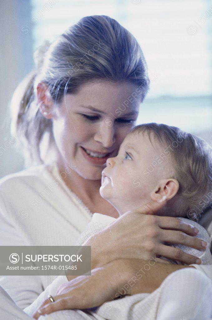 Stock Photo: 1574R-015485 Close-up of a mother hugging her son