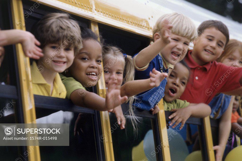 Stock Photo: 1574R-015498 Group of students looking out of a school bus