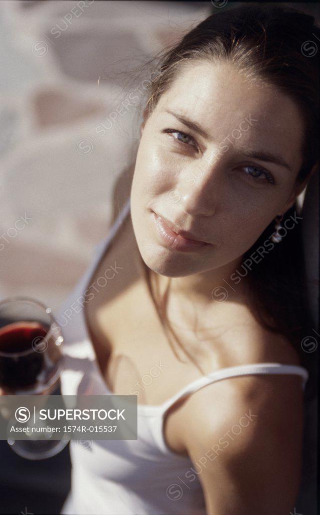 Stock Photo: 1574R-015537 High angle view of a young woman holding a glass of wine
