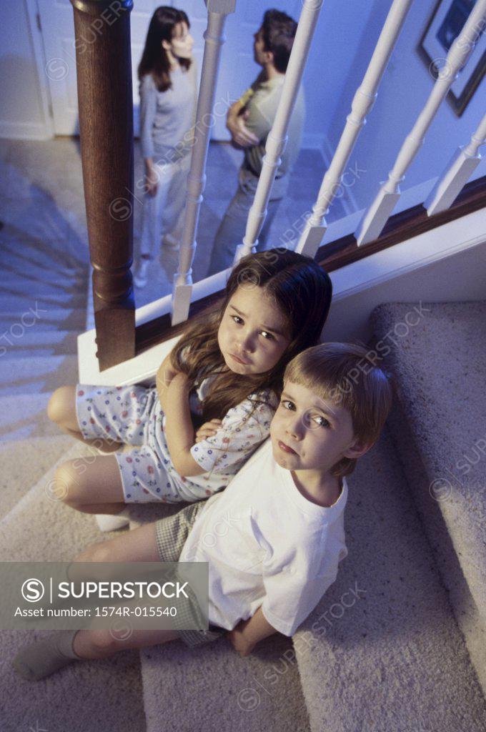 Stock Photo: 1574R-015540 High angle view of a brother and sister sitting on stairs