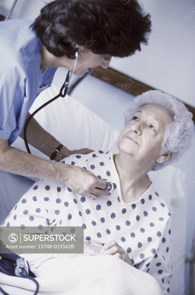 Stock Photo: 1574R-015562B High angle view of a female nurse examining a senior woman