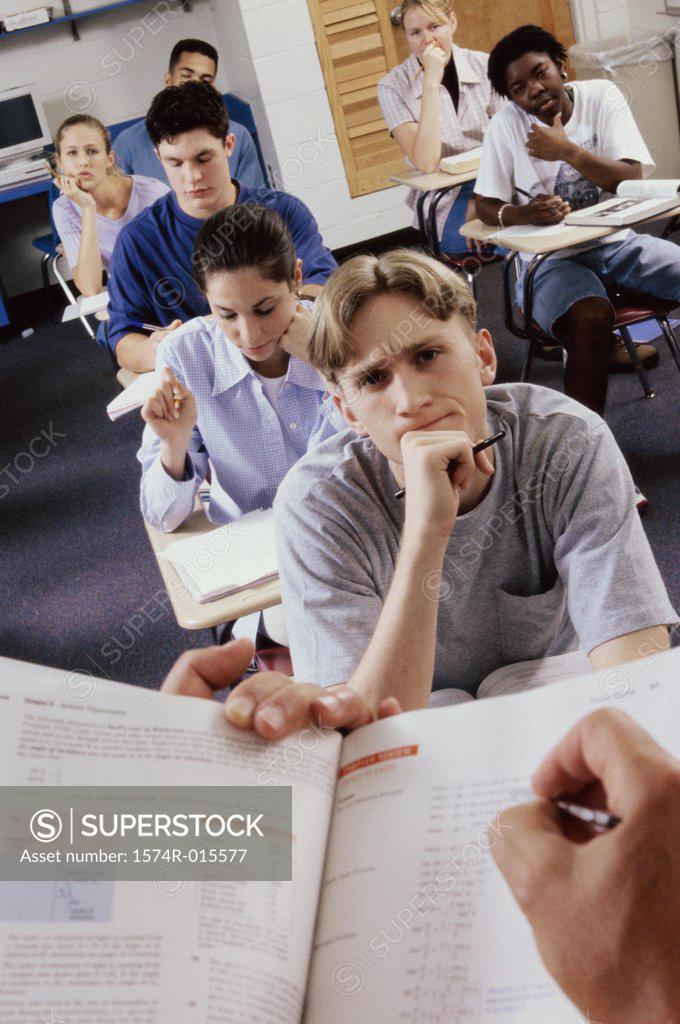 Stock Photo: 1574R-015577 Group of high school students studying in a classroom