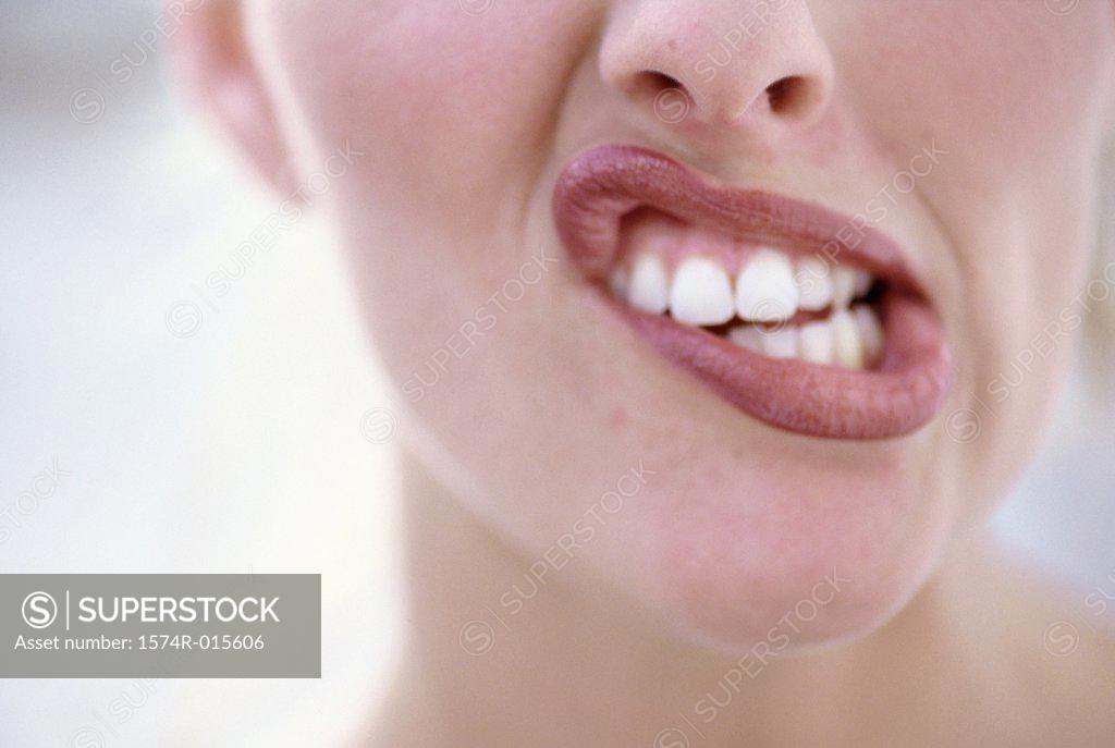 Stock Photo: 1574R-015606 Close-up of a young woman making a face