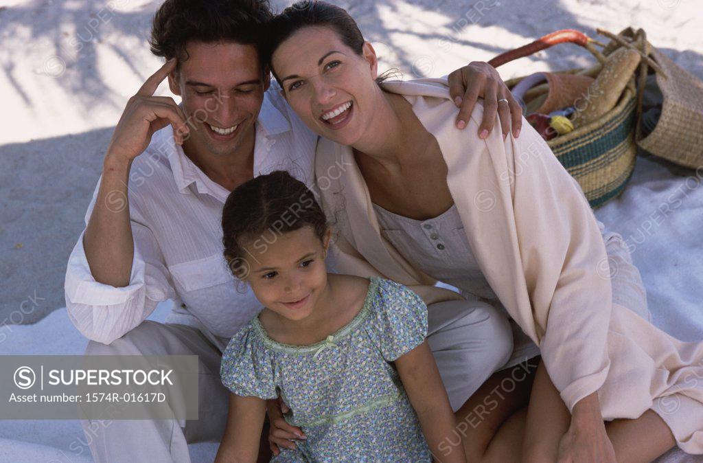 Stock Photo: 1574R-01617D High angle view of a couple at a picnic with their daughter
