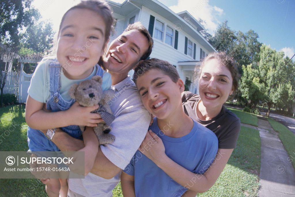 Stock Photo: 1574R-01643A Close-up of a couple standing in a garden with their son and daughter