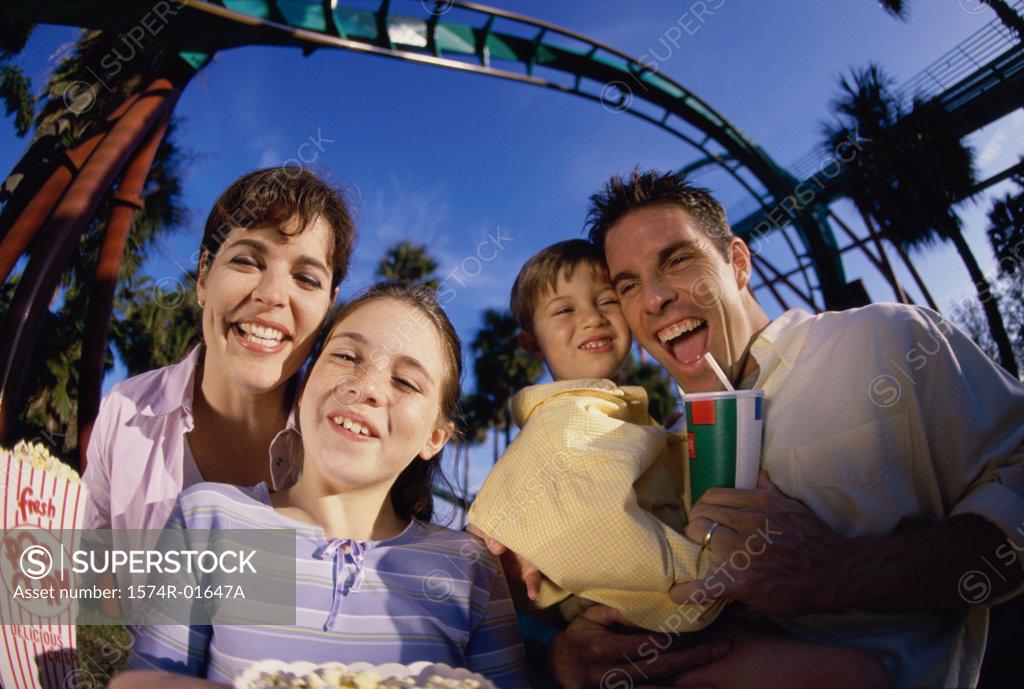 Stock Photo: 1574R-01647A Portrait of parents and their two children in an amusement park