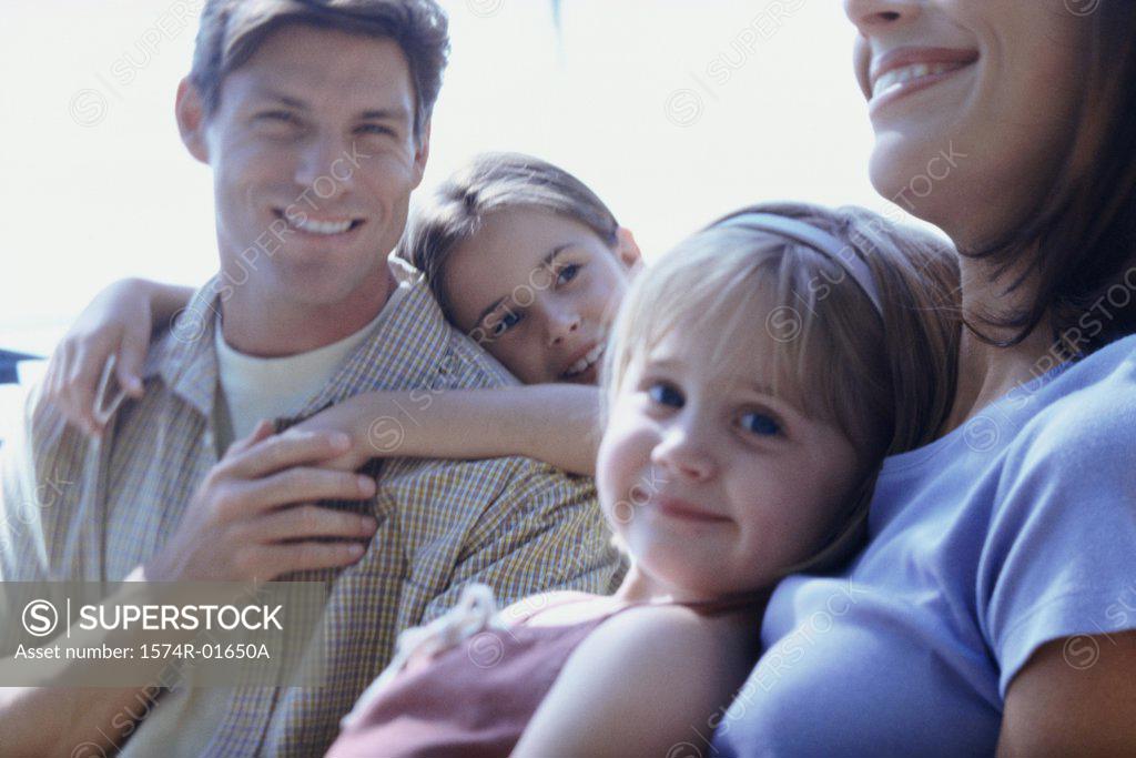 Stock Photo: 1574R-01650A Father and mother with their children