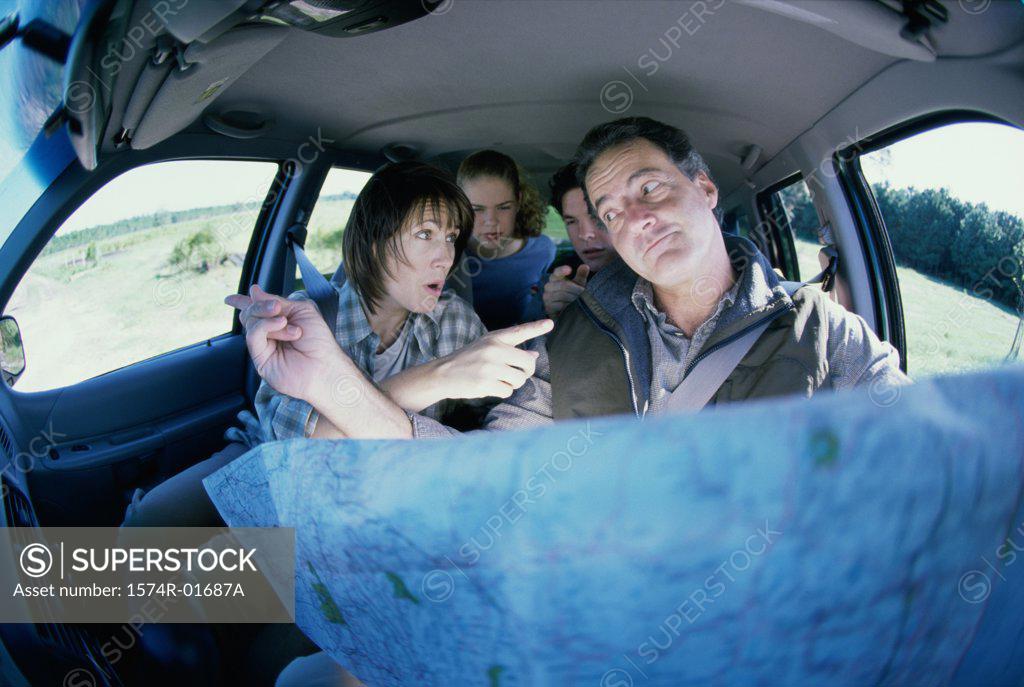 Stock Photo: 1574R-01687A Couple arguing over a map