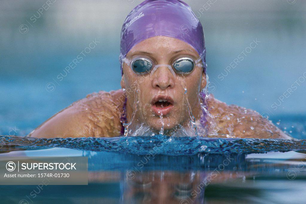 Stock Photo: 1574R-01730 Portrait of a woman swimming in a swimming pool