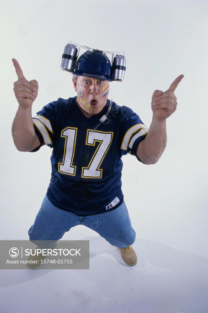 Stock Photo: 1574R-01755 Portrait of a sports fan holding his fingers up