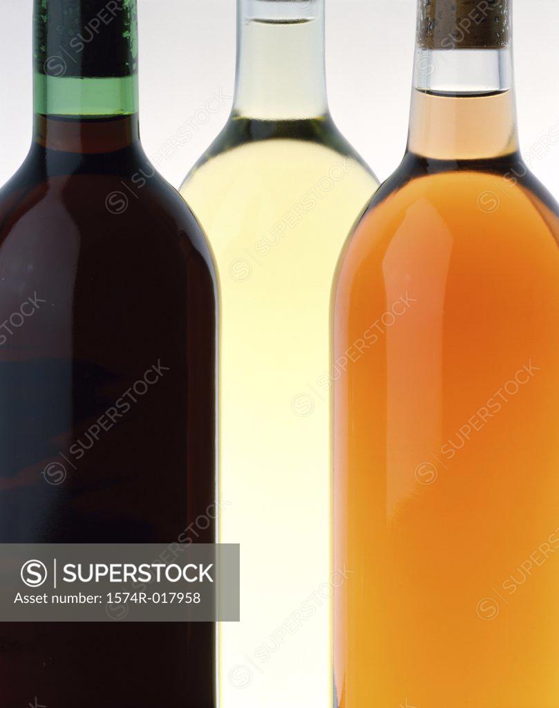 Stock Photo: 1574R-017958 Close-up of three wine bottles