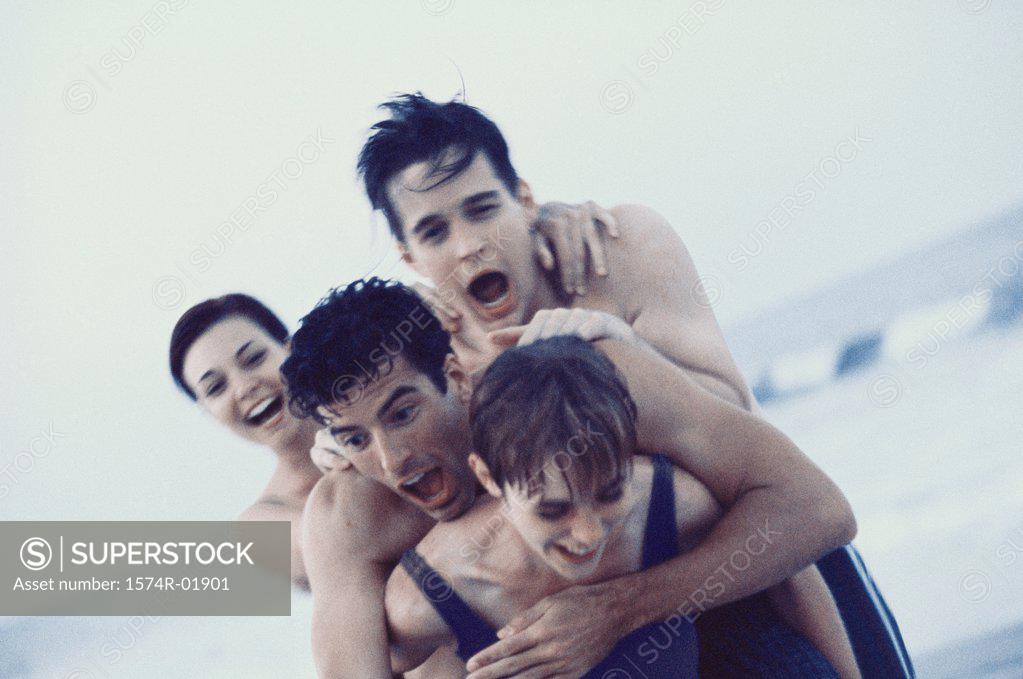 Stock Photo: 1574R-01901 Young men and women playing on beach